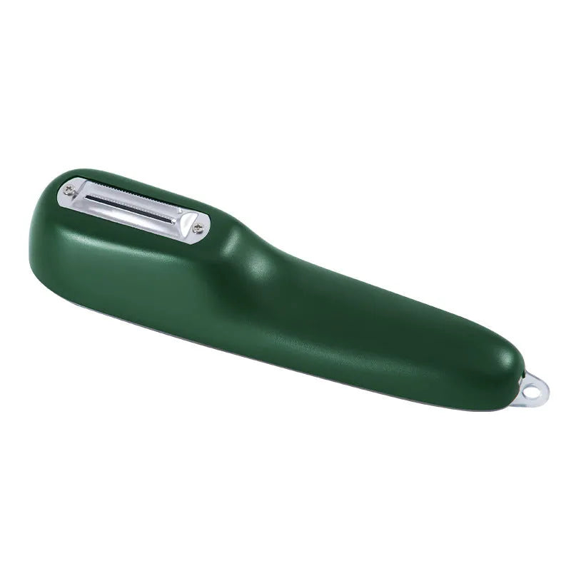 Dark green kitchen peeler with stainless steel blade inside its open storage tube on a counter.