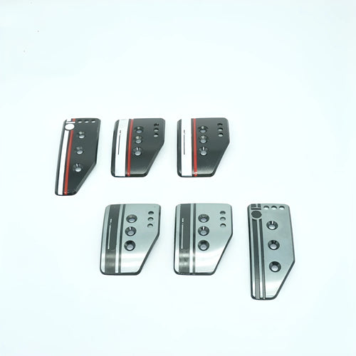 Aluminium alloy manual transmission pedal set showing accelerator, brake, and clutch pedals with mounting hardware