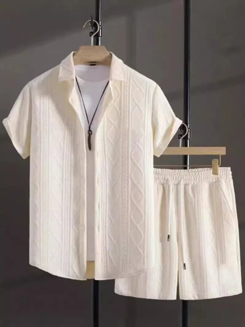 Man wearing a beige jacquard short sleeve suit jacket and matching shorts, a casual two-piece set.