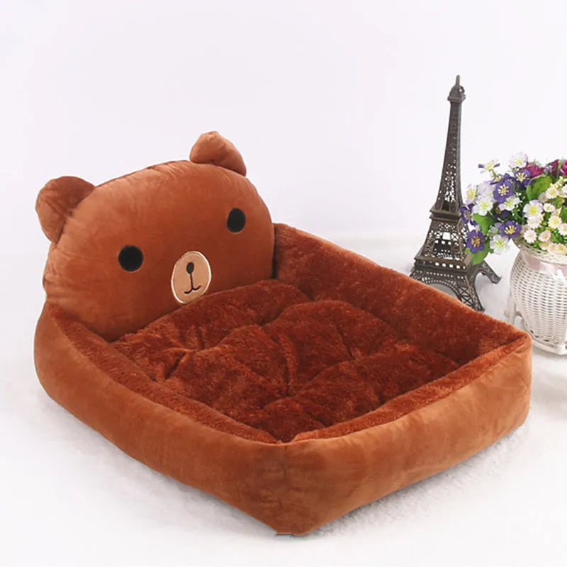 A colourful cartoon-style sofa bed for small pets, shown in blue, with raised edges for comfort.