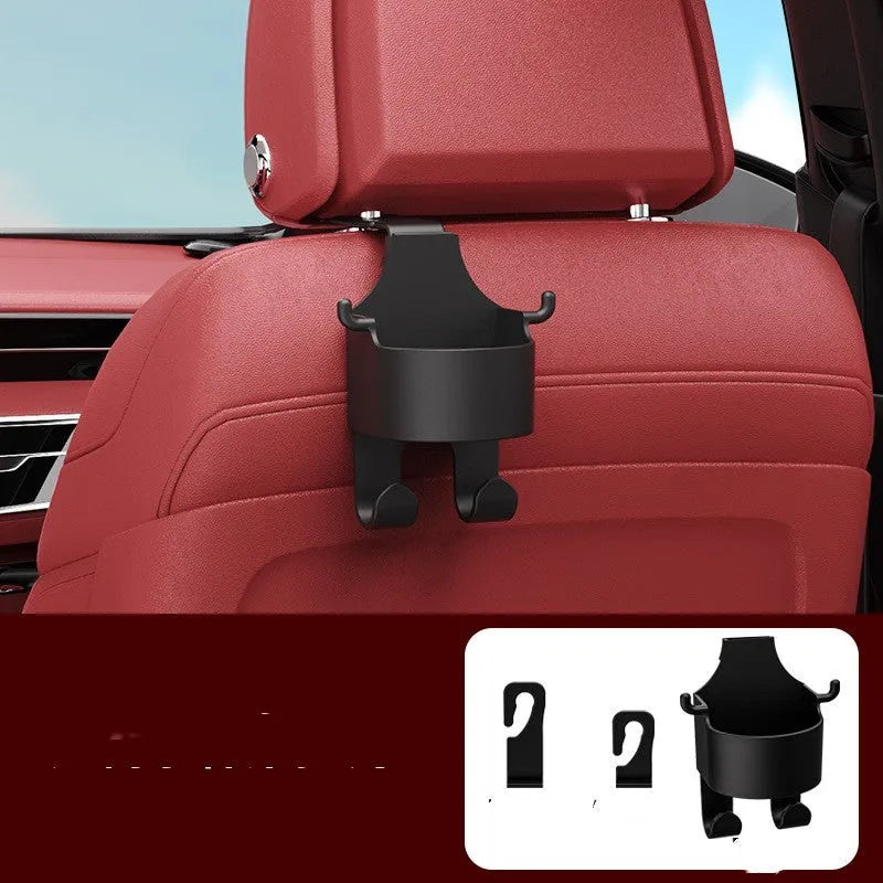 Black plastic car seat back organiser with cup holder and hook, mounted on a car headrest.