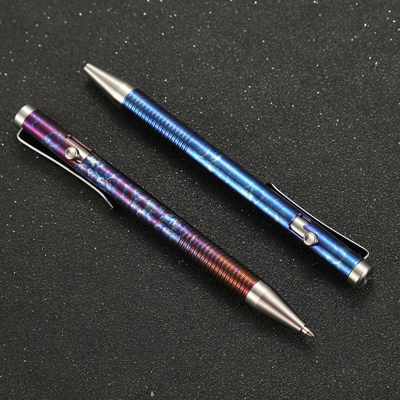 Titanium alloy ball pen with gun bolt handle and iridescent magic colour phantom finish.
