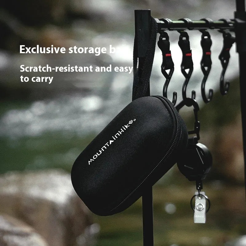 Mini hexagon foldable alcohol stove for camping, shown in black colour with dimensions 9.5x8.5x15cm
