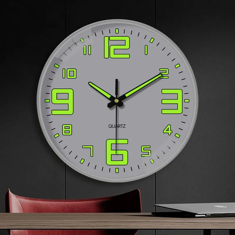 Modern round luminous wall clock 20cm diameter with plastic case on a wall