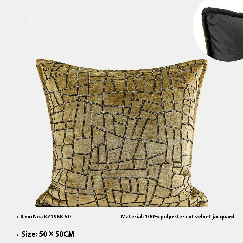 Local gold geometric abstract pattern on a square polyester cushion cover.