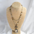 Tribal style two-layer chain necklace with glass and stone pendants in beige and blue colours