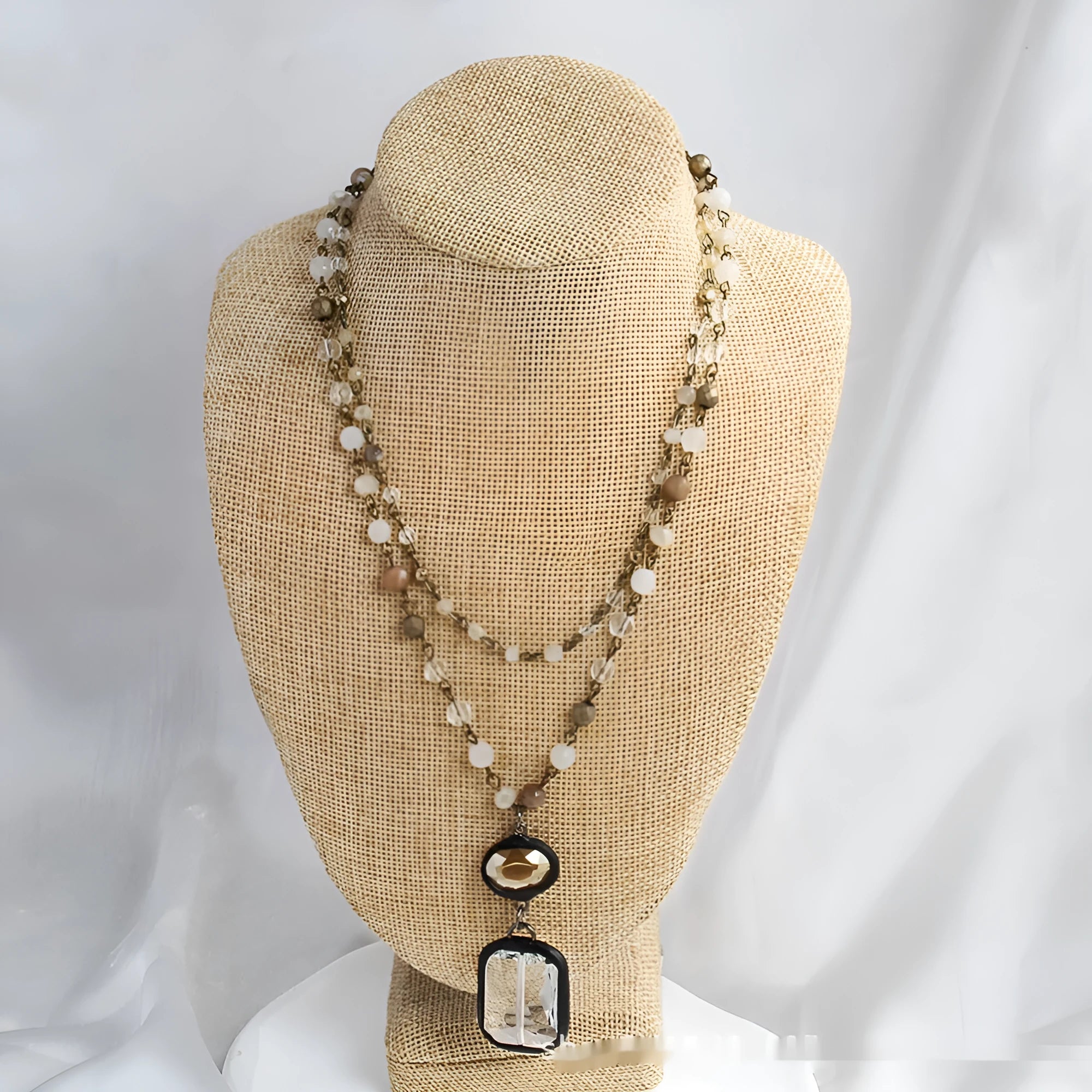 Tribal style two-layer chain necklace with glass and stone pendants in beige and blue colours