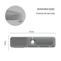 Silicone sink splash guard pad in beige colour showing sloped design with two drain channels.