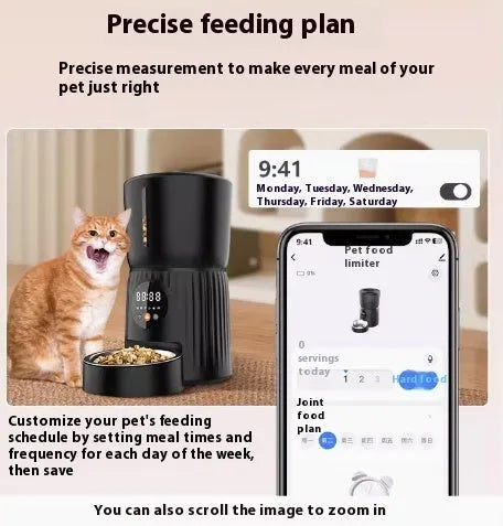Black automatic pet feeder with digital display and food hopper on a countertop.