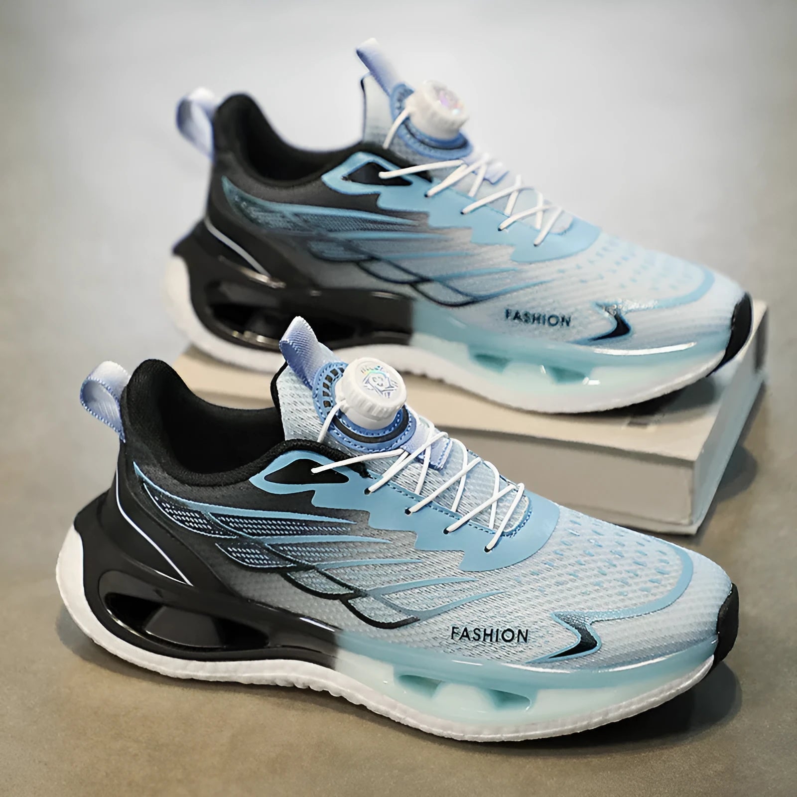 Men's low-top sneaker with a rotating button closure on the side, shown in light blue mesh.