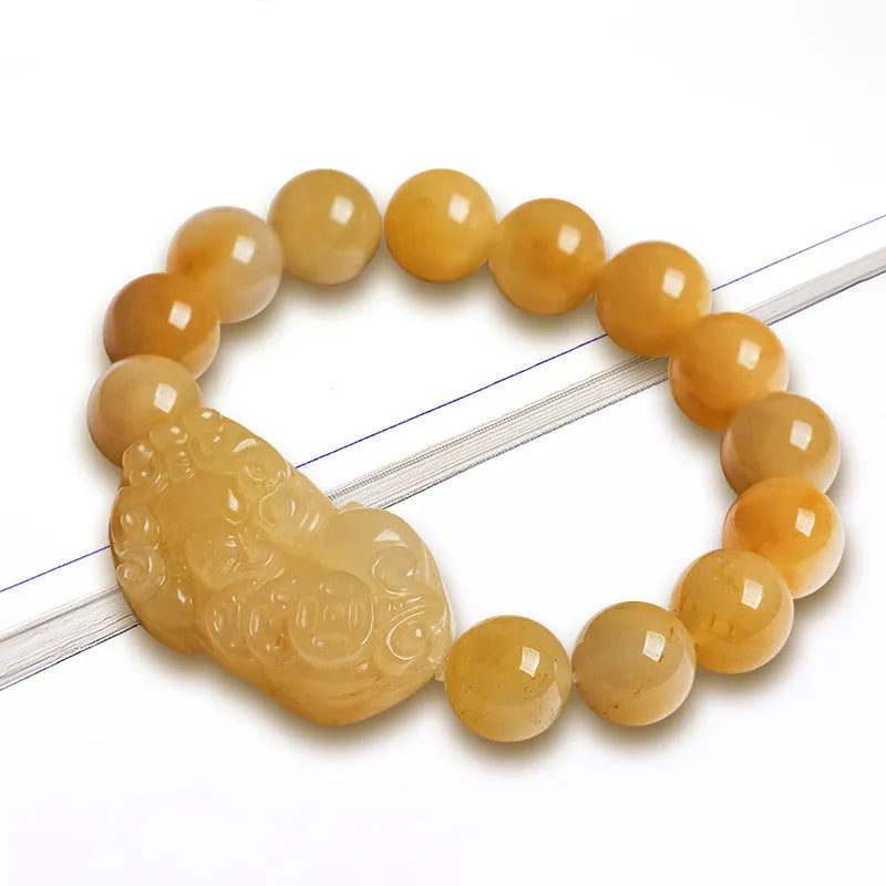 Golden Thread Jinsi Jade money bracelet with carved beads in two size options.