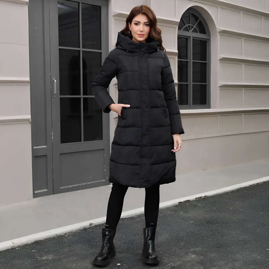 Black hooded long cotton jacket for men with a slim fit design on a model.
