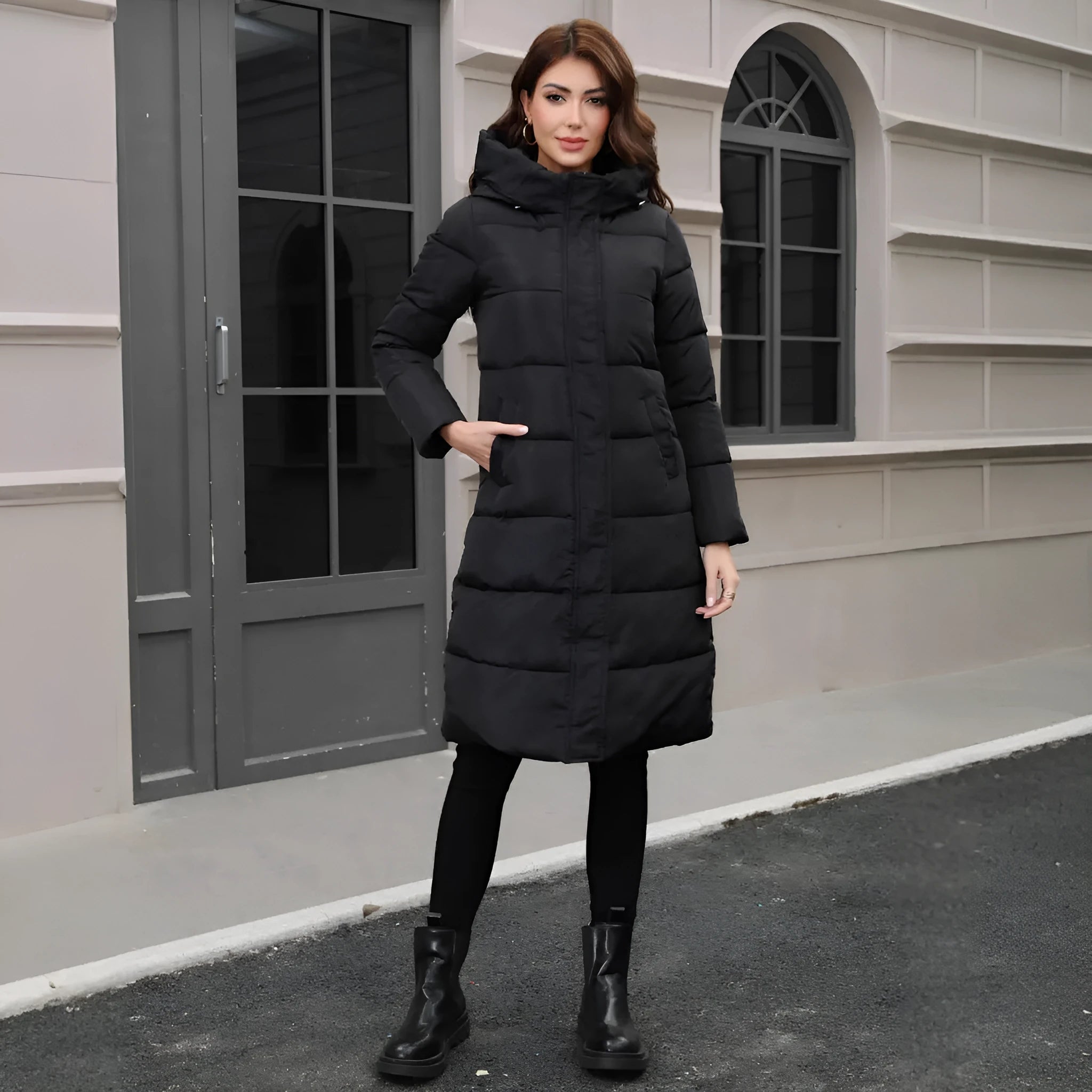 Black hooded long cotton jacket for men with a slim fit design on a model.