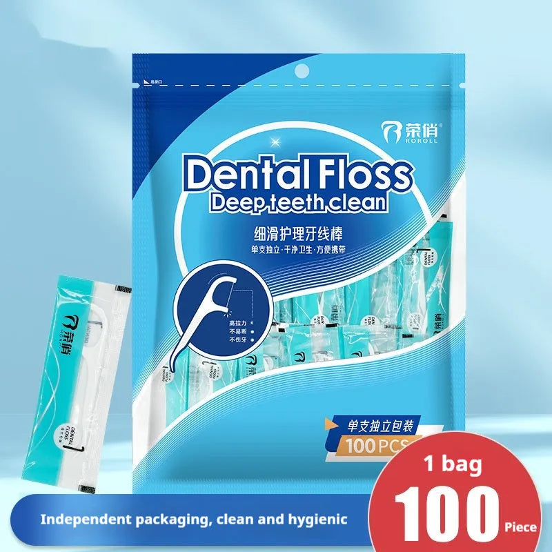 Bulk bag containing 100 individually plastic-wrapped disposable dental floss pieces on a white background.