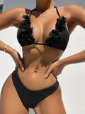 Black gathered style women's bikini top and shorts swimwear set on a mannequin