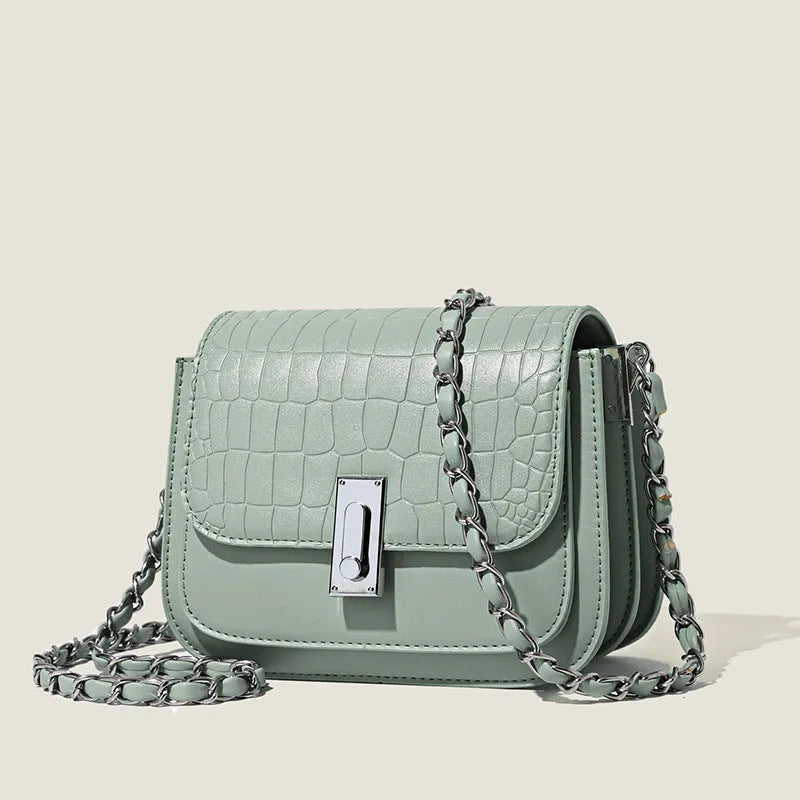 Women's black PU leather chain shoulder bag showing internal phone compartment and sewing thread detailing