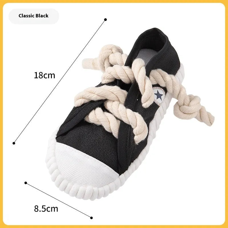 Slipper-shaped plastic dog chew toy in three colours with bends for chewing