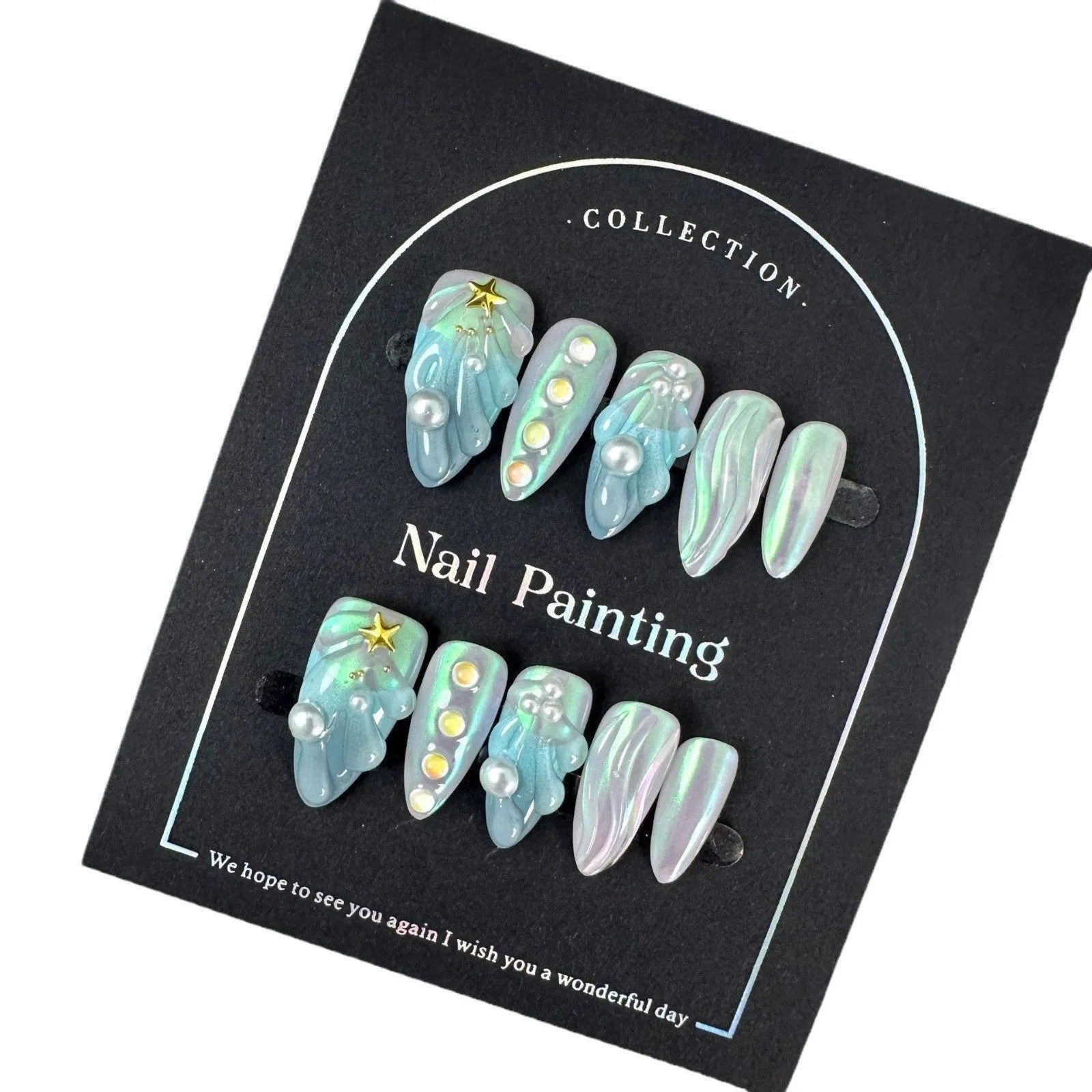 Blue plastic artificial nail tips set on a card, showing sizes labelled XS, S, M, and L.
