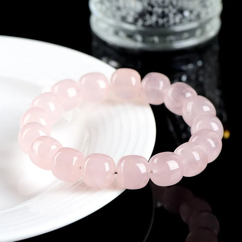 Natural bamboo crystal barrel bead bracelet with geometric pink beads measuring 11-12mm