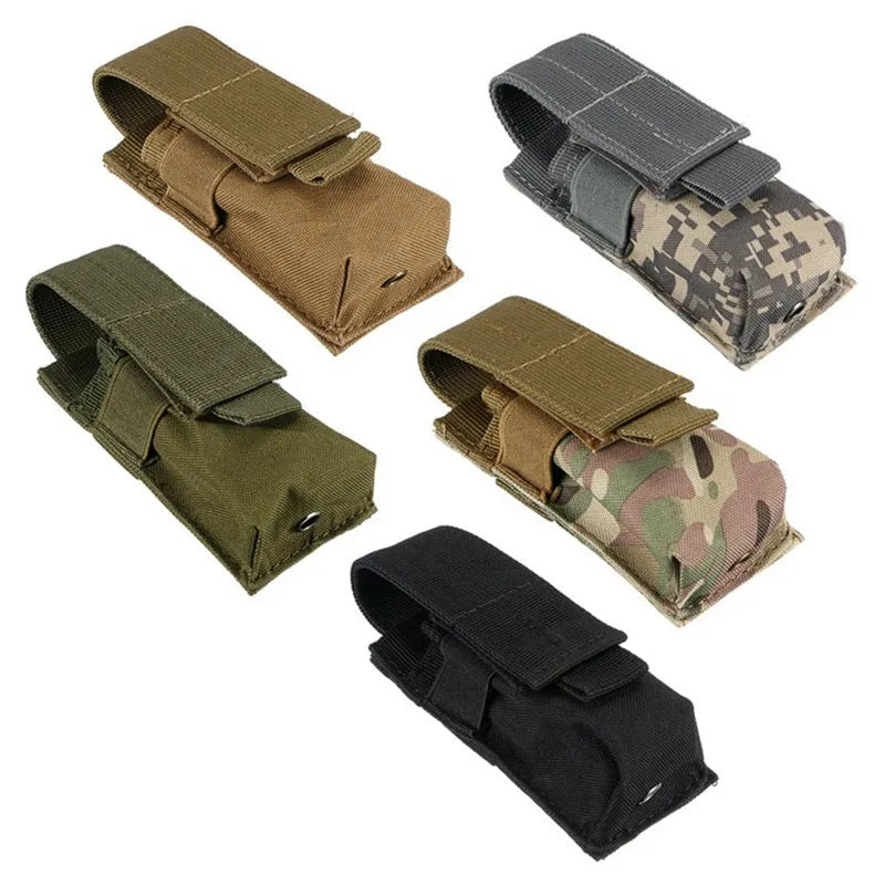 Black tactical MOLLE-compatible waist bag for pistol cartridges and small flashlights, shown with elastic cord buckle.