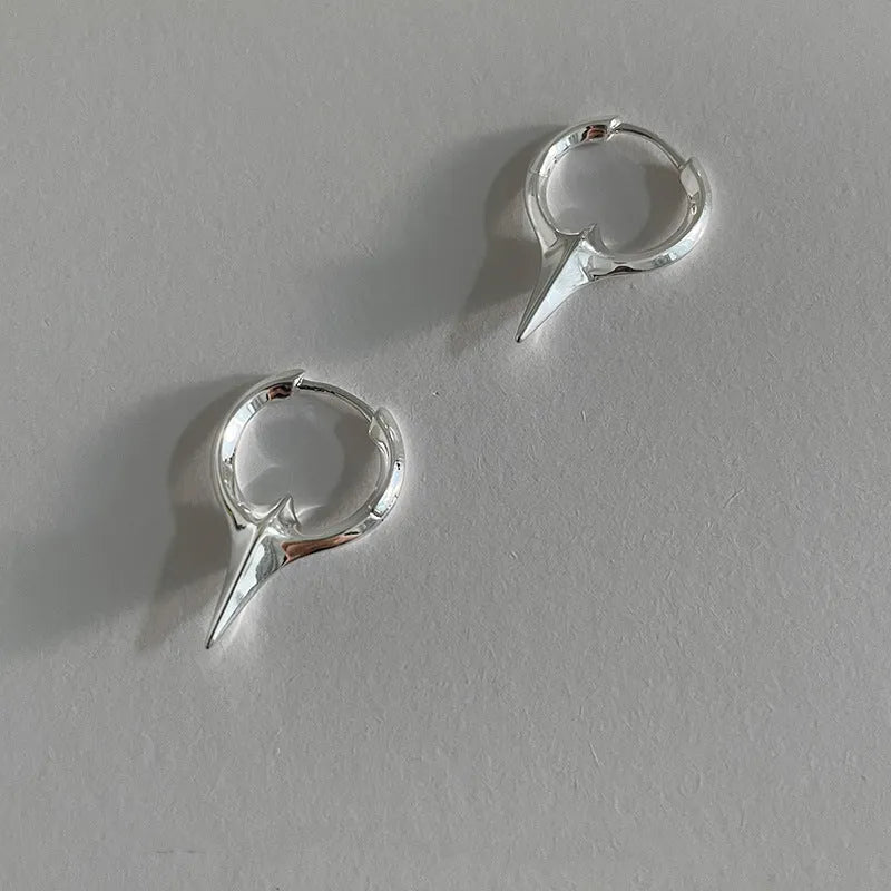 Geometric star-shaped ear clips with electroplated platinum finish on copper construction