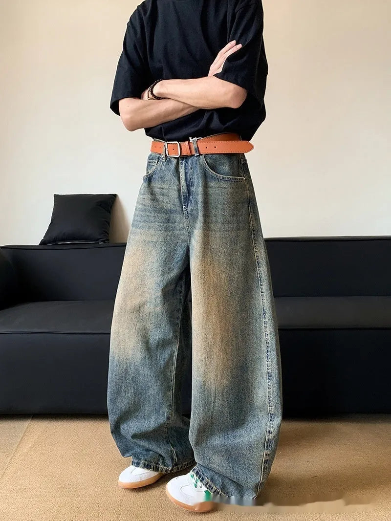 Men's retro blue distressed jeans with machete wash pattern and wide-leg design