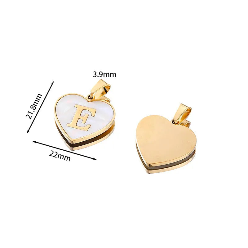 Gold chain necklace with white shell heart pendant featuring single letter customisation option