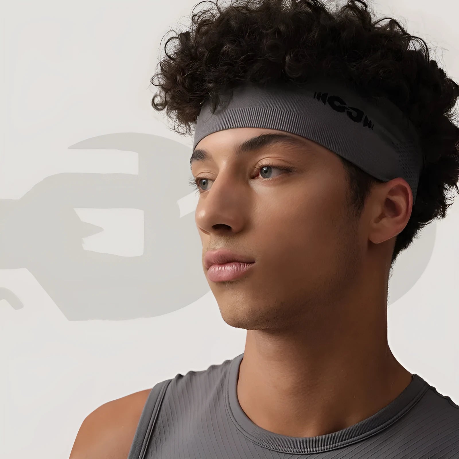 Seamless knitted sports hair band in black, grey, and blue for cycling and running.