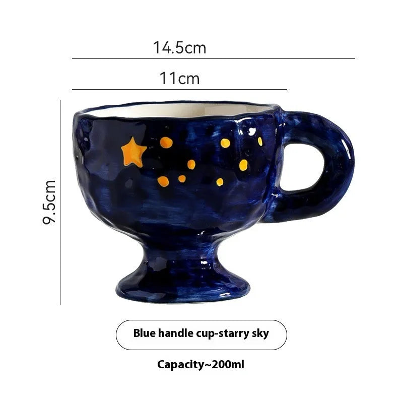 A handmade, irregularly shaped ceramic mug in a solid colour, shown on a table.