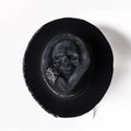 Handmade wool skull hat with conical crown design shown in single colour option