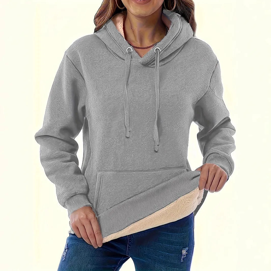 Women's thick grey hooded sweater with a 3D pattern and front pockets on a hanger.