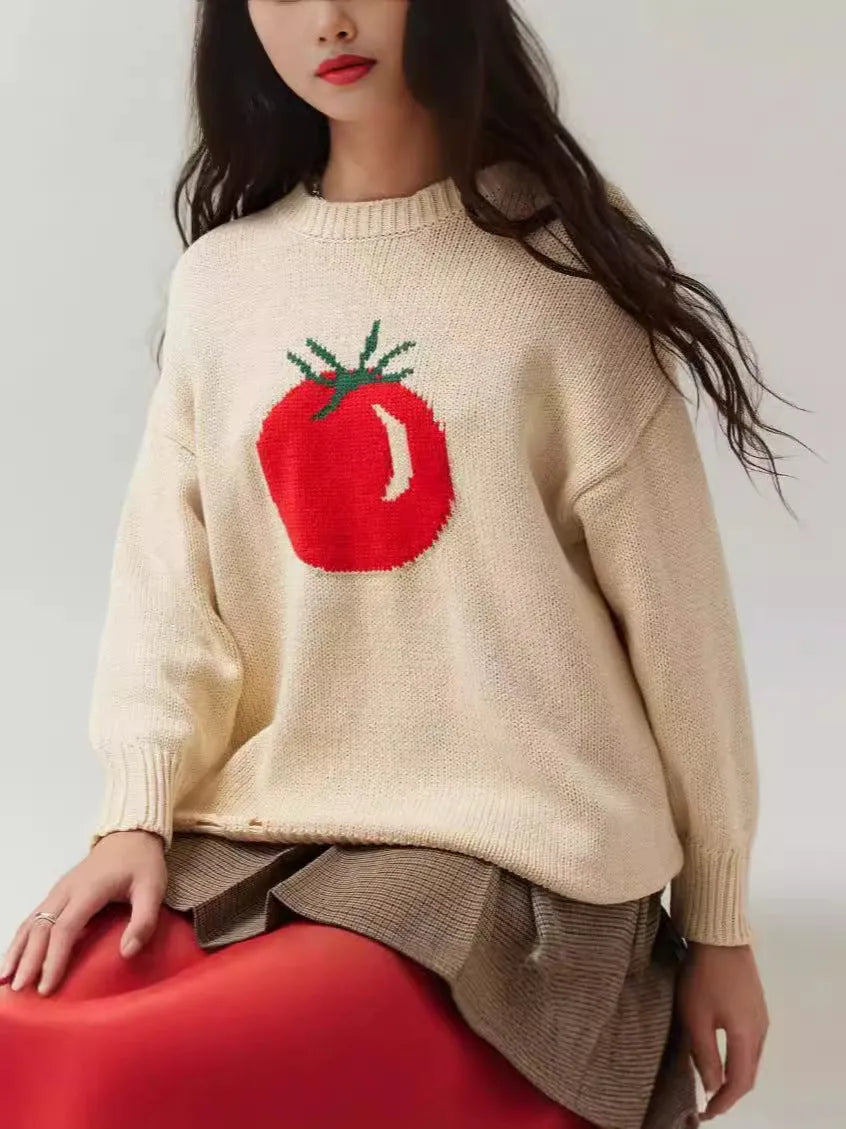 Women's milky white acrylic round neck sweater with jacquard long sleeves, laid flat.