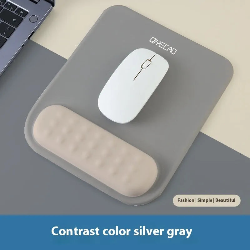 Ergonomic mouse pad with raised wrist support in cloth silicone material showing colour options
