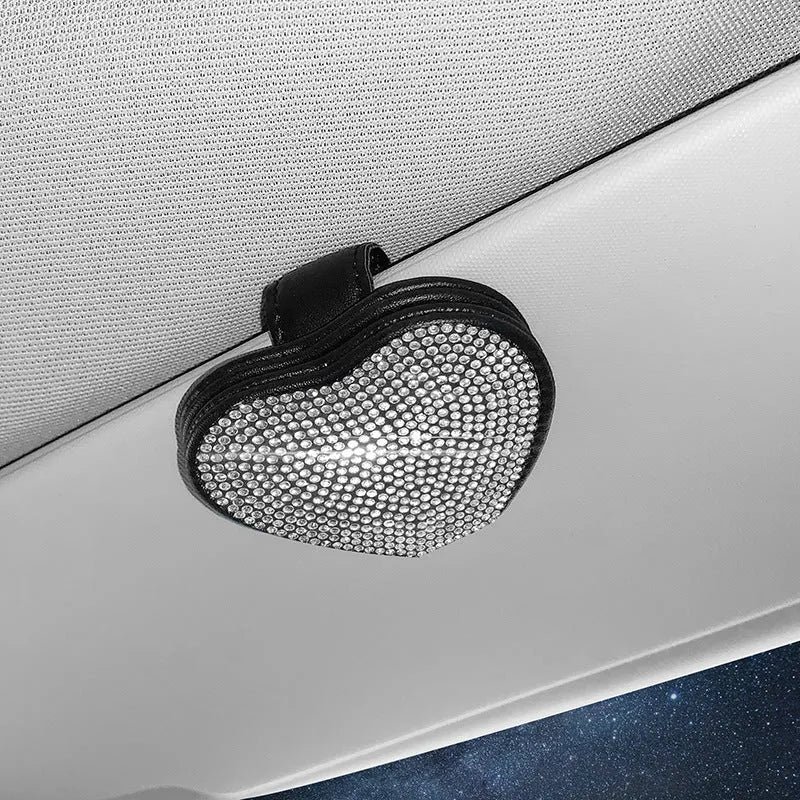 Diamond decorated PU leather magnetic clip for car sun visor holding sunglasses.