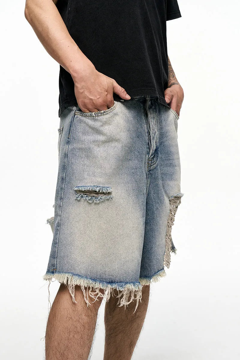 Men's light blue denim shorts with baggy wide leg cut and retro washed finish