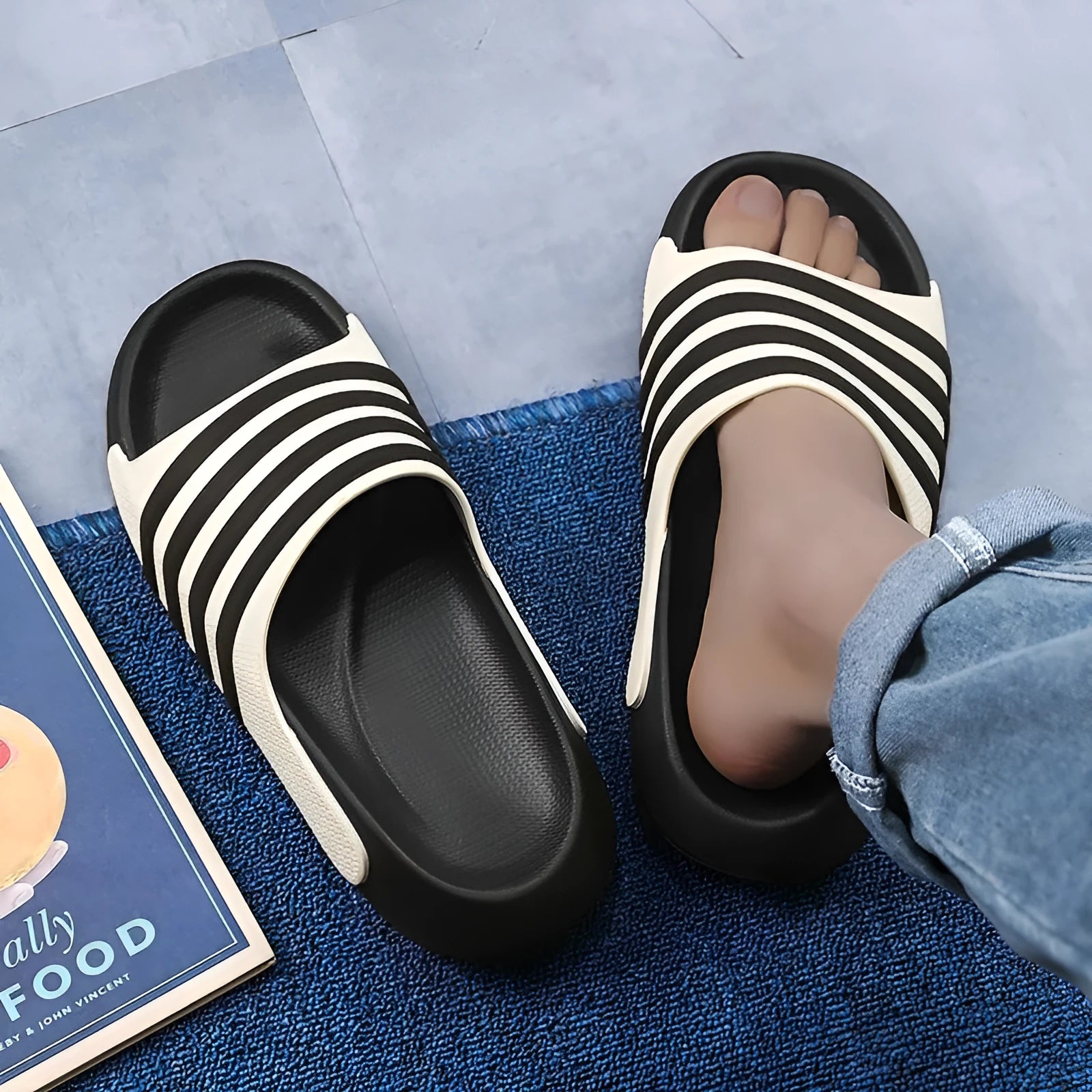 Casual unisex slippers with a light EVA sole and a structured PVC upper, shown in a neutral colour.