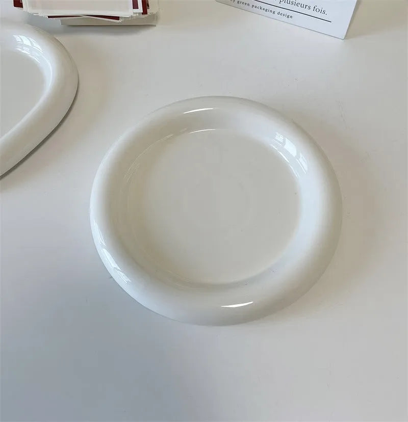 White ceramic plate with bear doodle design, 20cm diameter, on a table.