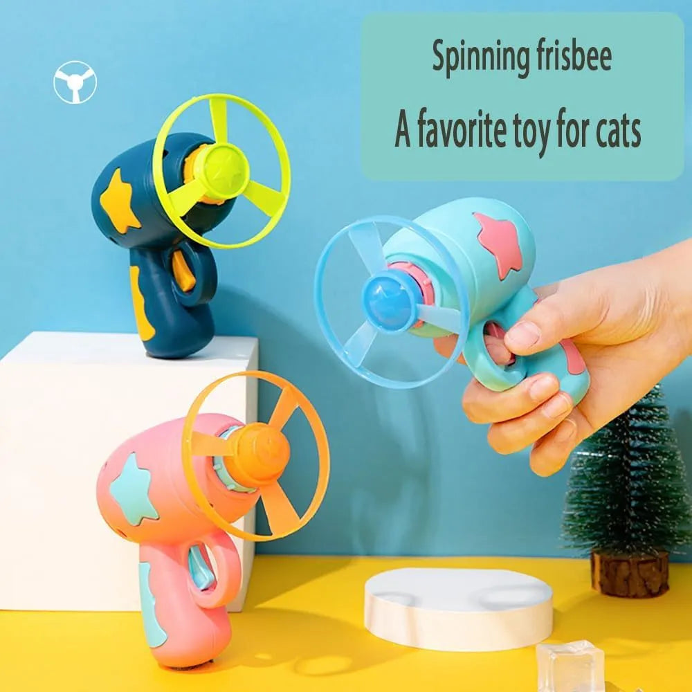 Blue plastic cat toy gun with frisbee launcher for indoor cats on white background