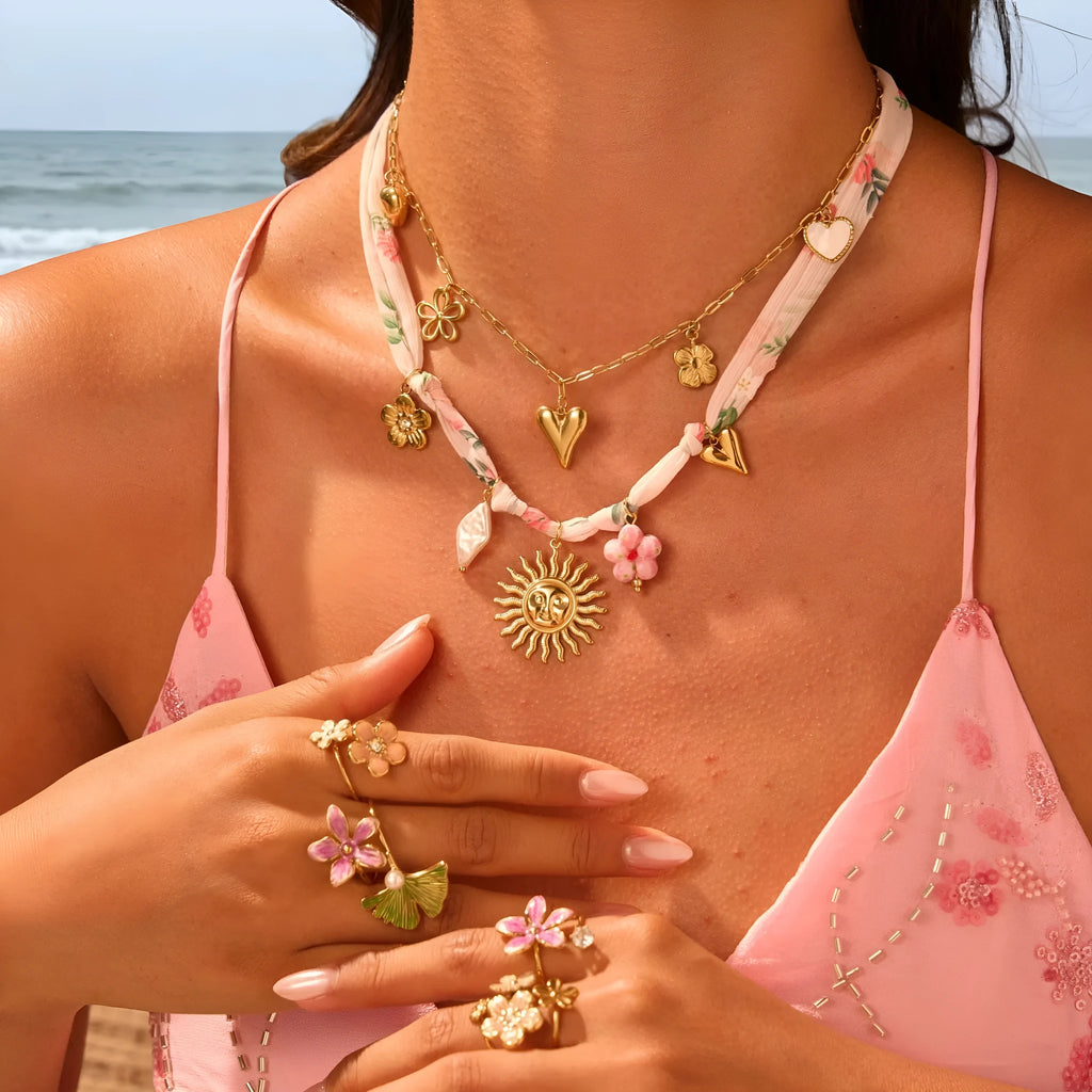 Gold plated stainless steel sun pendant necklace with geometric design on adjustable chain