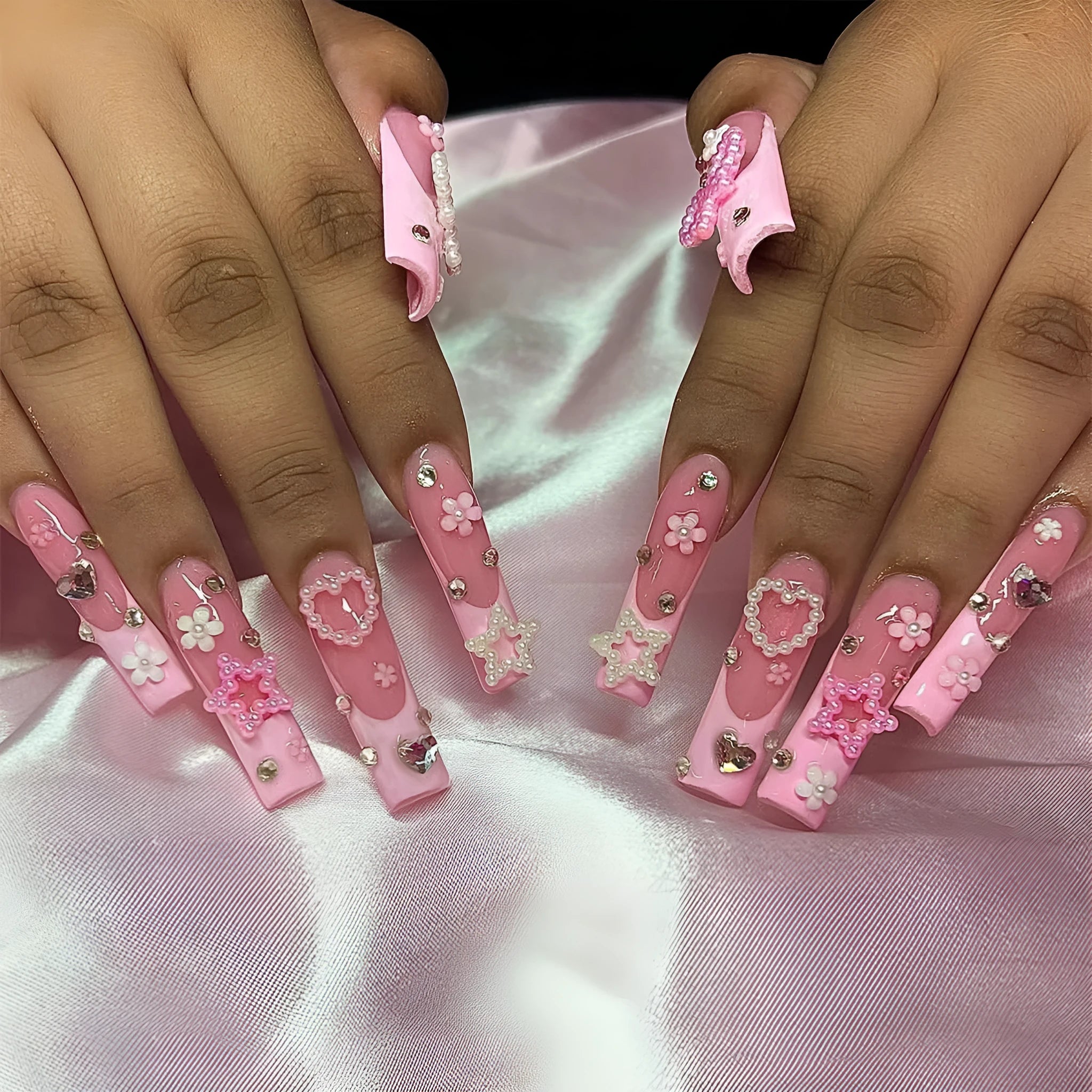 Long French-style press-on false nails with a spot drill bow decoration and love pattern in XB-70-48 colour.