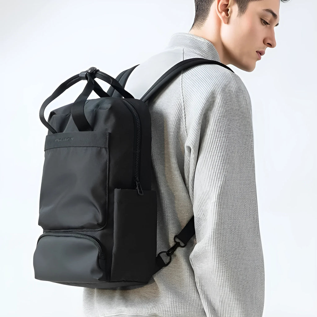 Black Oxford cloth computer backpack showing main compartment and 20-35L capacity.