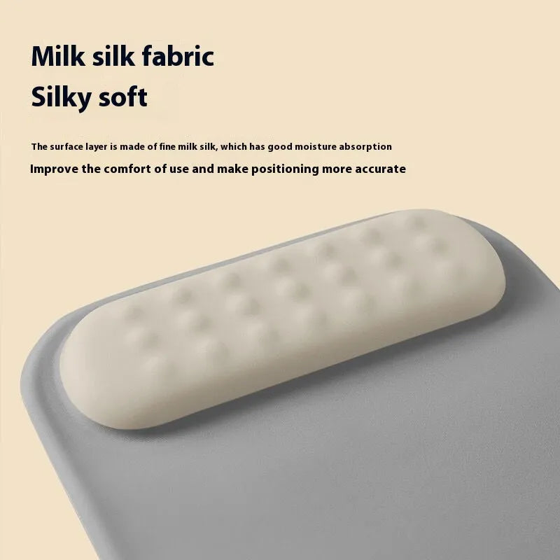 Ergonomic mouse pad with raised wrist support in cloth silicone material showing colour options