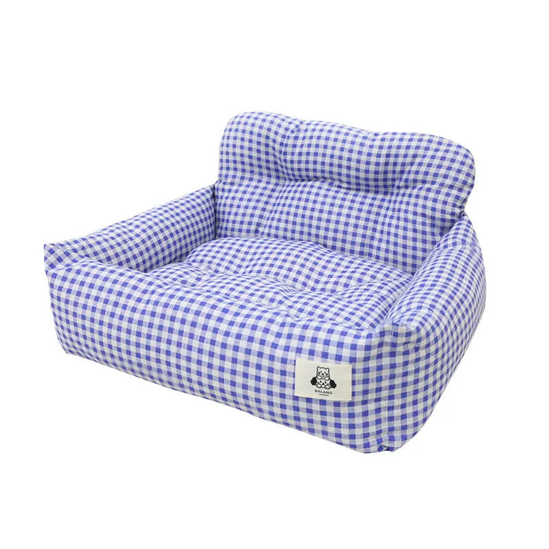 Car-mounted pet carrier nest in blue plaid cloth for dog transport