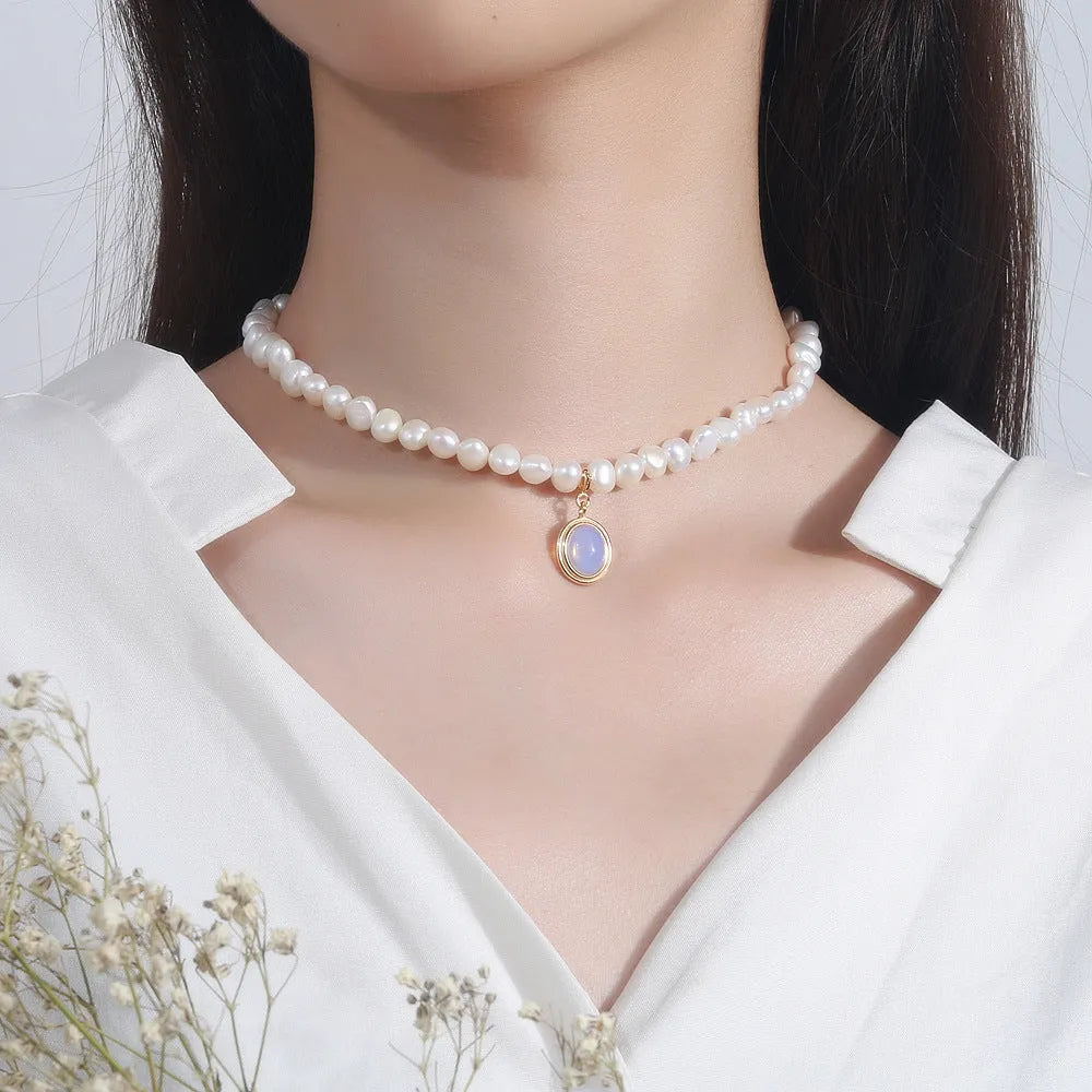 925 sterling silver necklace with geometric round medal pearl pendant on an adjustable chain.