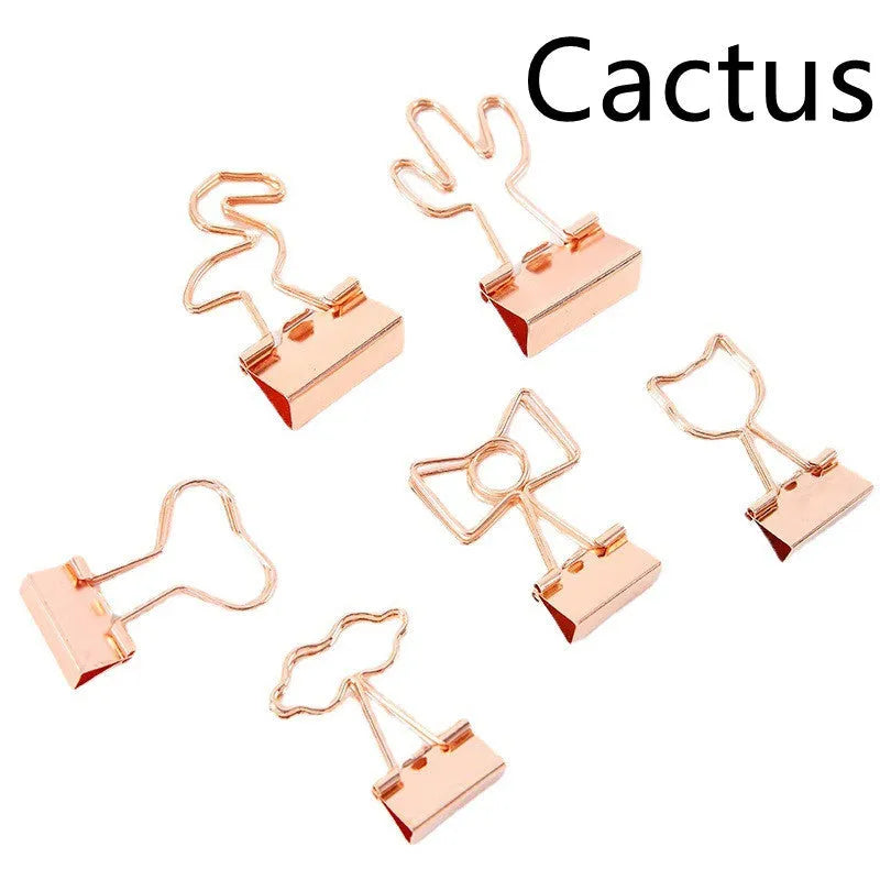 Gold metal decorative paper clip showing flamingo, love, cloud, cat, cactus, and bow shape options.
