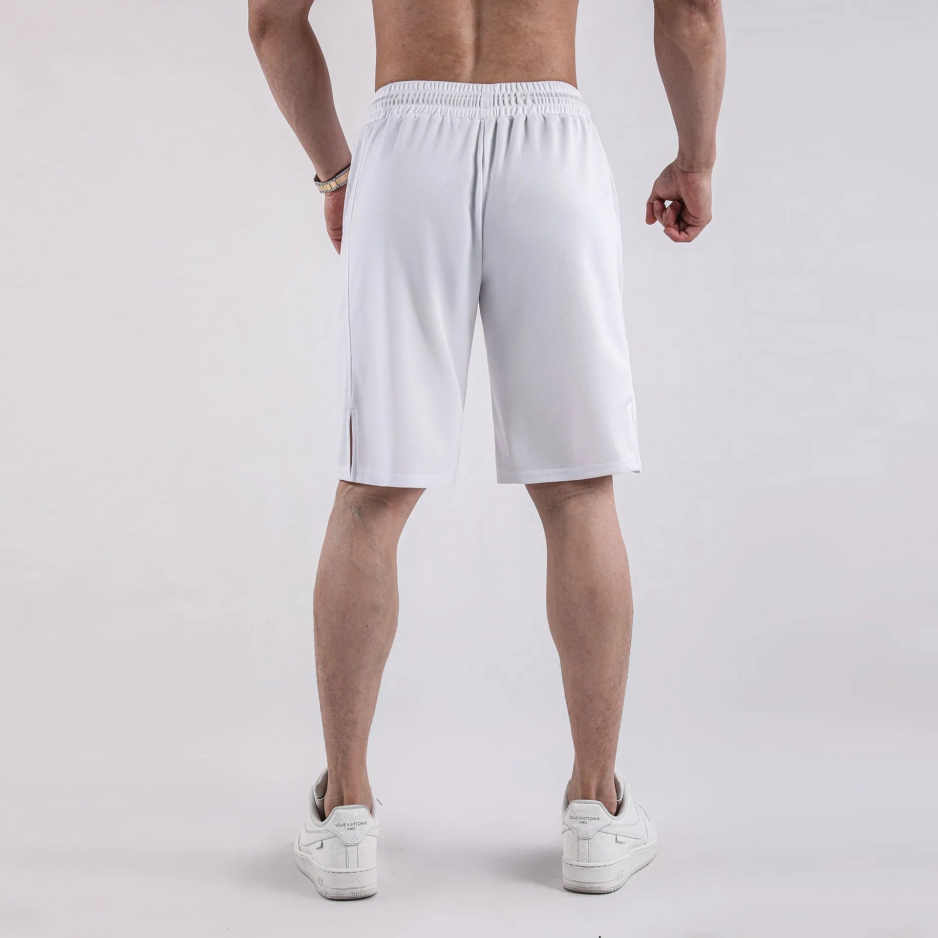Men's quick-drying mesh shorts in black with elastic waistband and loose fit design