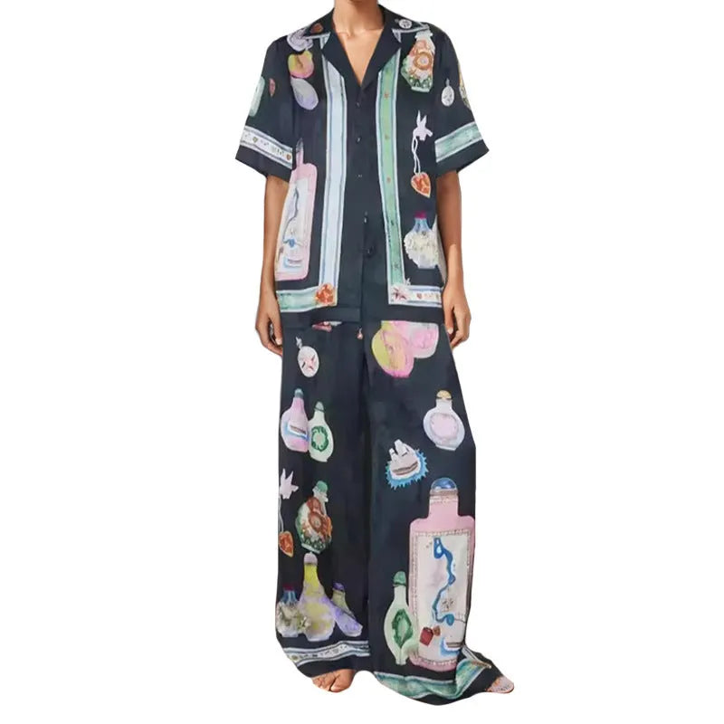 Women's black cartoon pattern holiday fashion set with trousers and cardigan-style top