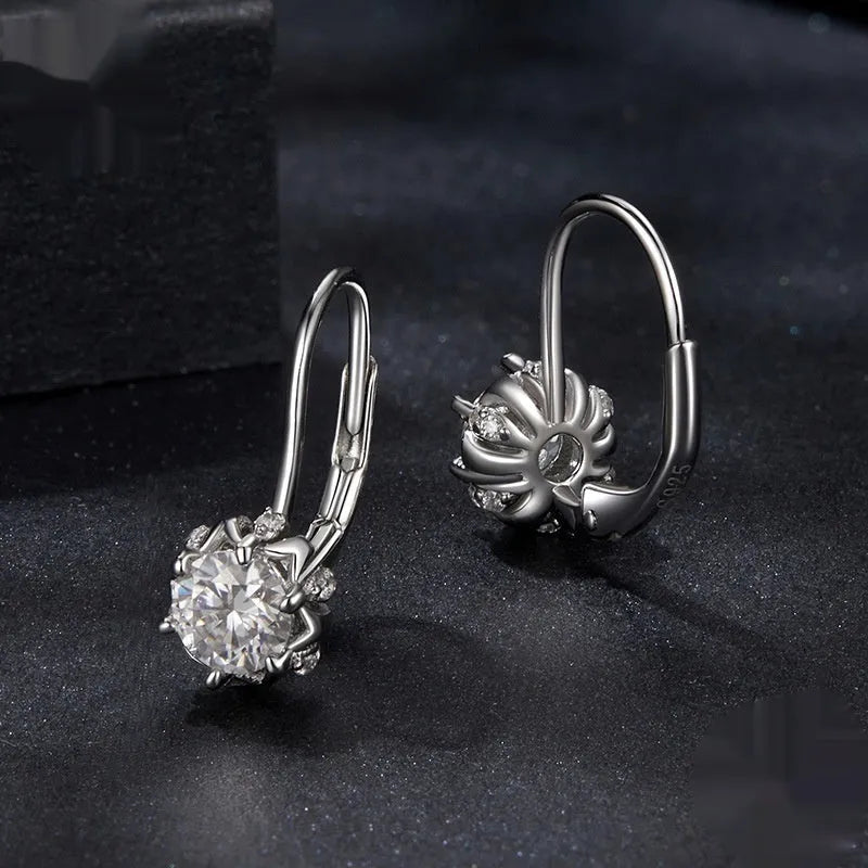 Sterling silver flower bud ear clips with white gold plating and moissanite stone