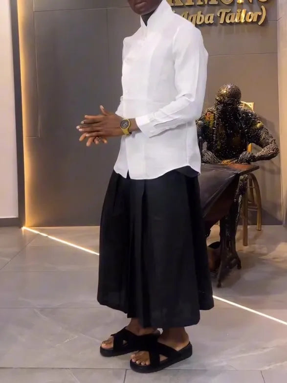 Women's white asymmetric hem shirt and black pleated trousers co-ord set in polyester