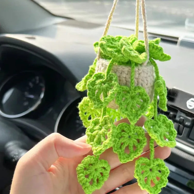 Knitted green and white car plant decoration with hanging rope